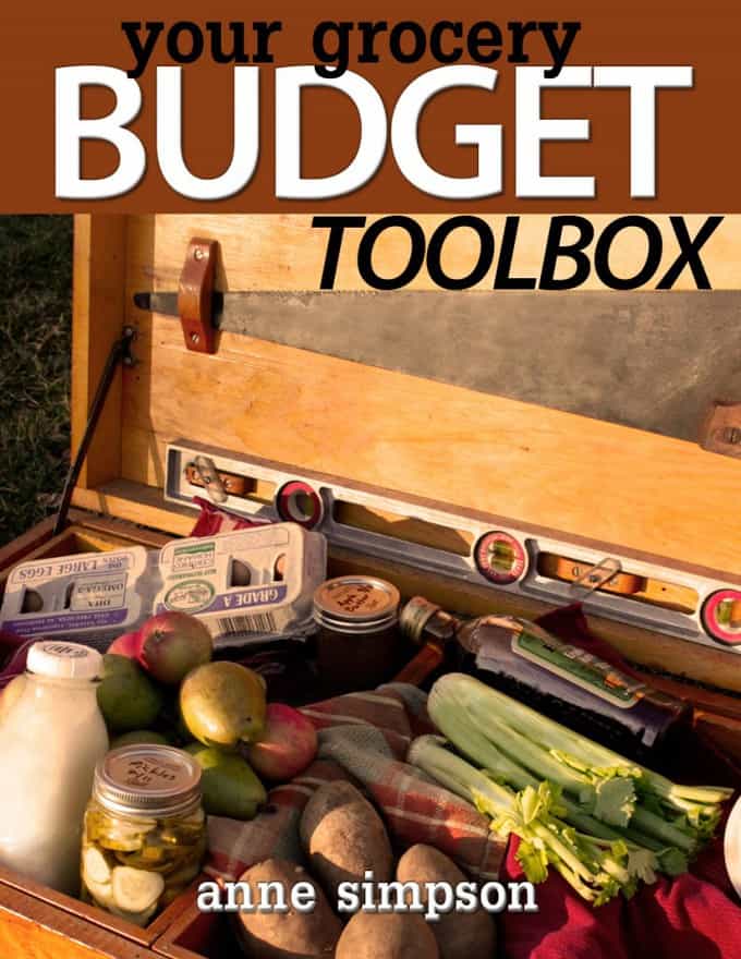 A wooden tool box with a variety of foods in it.