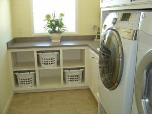 small-cabinet-for-laundry-basket-in-modern-laundry-room