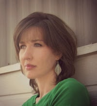 A woman in a green shirt.