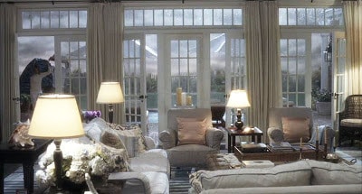 A living room filled with furniture and a large window.