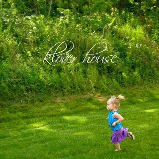 A little girl running in the grass with text above her.
