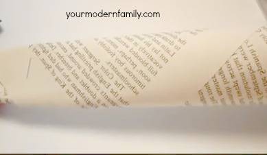 A close up of a piece of paper with text on it rolled up.