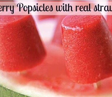 A close up of a strawberry popsicles made with real strawberries.