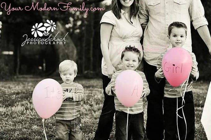 A family posing for a birth announcement photo.