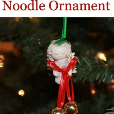 A angel ornament on a Christmas tree.