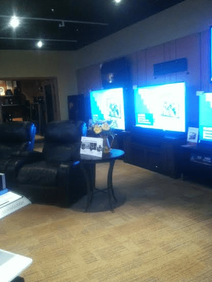 A flat screen tv  in a game room.