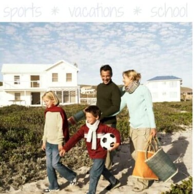 A group of people walking toward the beach.