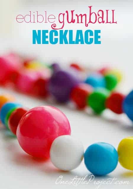 A necklace made of gumballs and text above it.