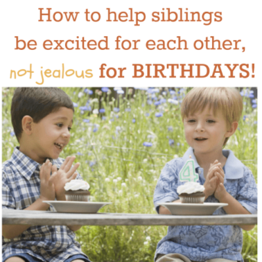 Two boys sitting in front of Birthday cupcakes.