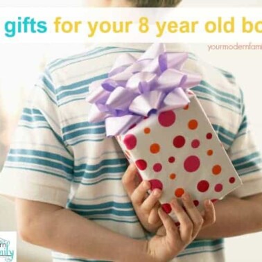 A boy holding a wrapped present behind his back with text above him.