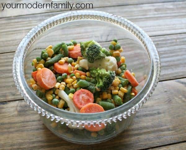 A bowl of mixed vegetables in a plastic cup.