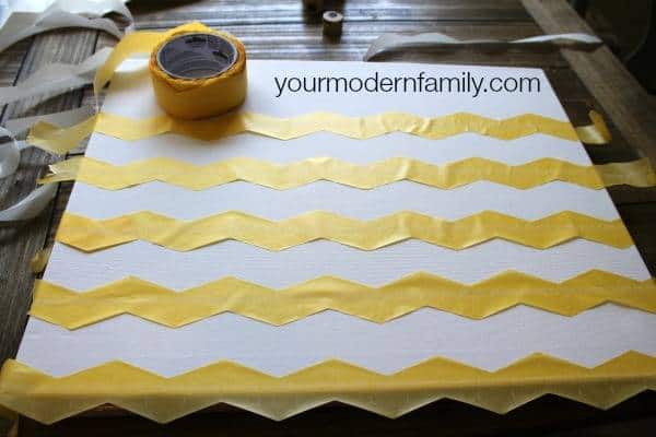 A canvas with yellow tape chevron stripes across it.