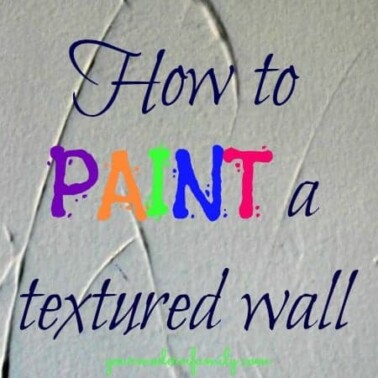 A textured wall with text on it.