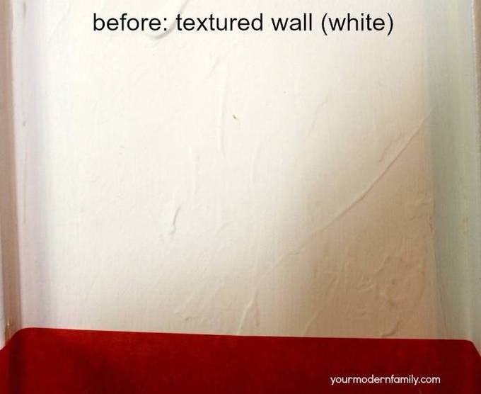 A close up of a white textured wall.