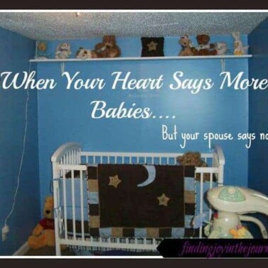 A baby's room with a crib and text above it.