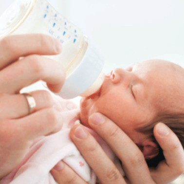 A baby drinking from bottle.