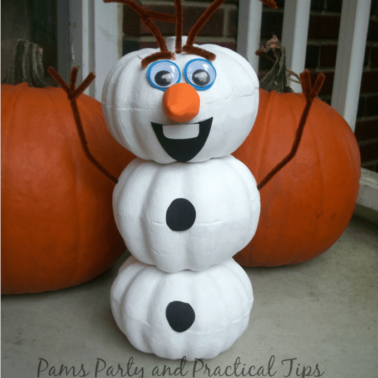 White pumpkins made into an Olaf snowman with other pumpkins behind it.