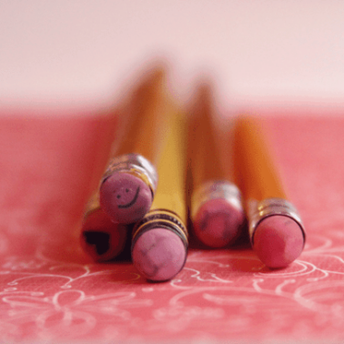 A close up of pencils lying on a table.