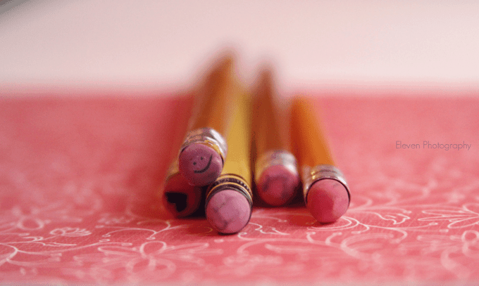 A close up of pencils lying on a table.