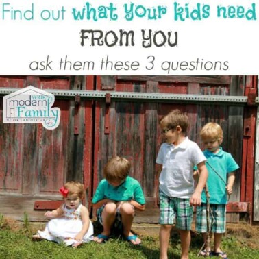 A group of kids standing in front of a fence with text above them.