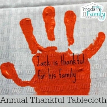 A craft of a child's painted hand print with text on it.