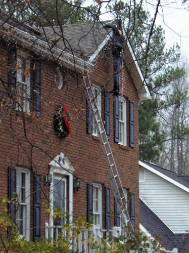 christmas-xmas-prank-hoax-fake-man-hanging-from-roof-xmas-lights