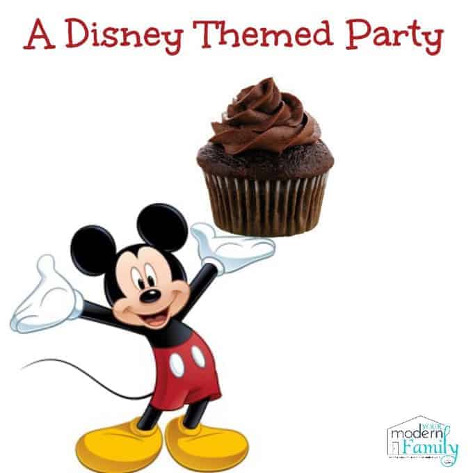 Mickey Mouse holding a cupcake