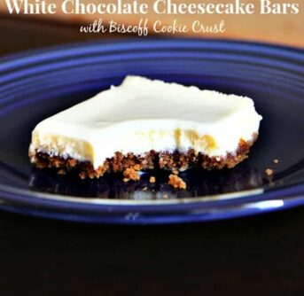 A piece of White Chocolate Cheesecake bar on a blue plate.