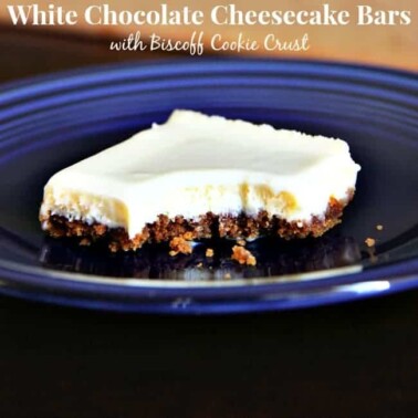 A piece of White Chocolate Cheesecake bar on a blue plate.