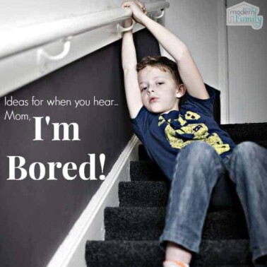 A boy laying on carpeted stairs while hanging on the railing with text beside him.