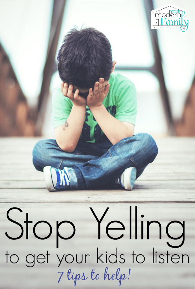 A boy sitting on the ground with his head in his hands.   How to stop yelling at your kids