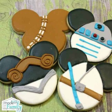 Cookies shaped and decorated like Star Wars Mickey Mouse.