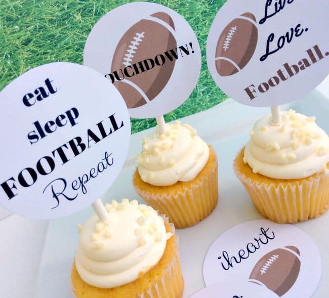 Football cupcake toppers in cupcakes.