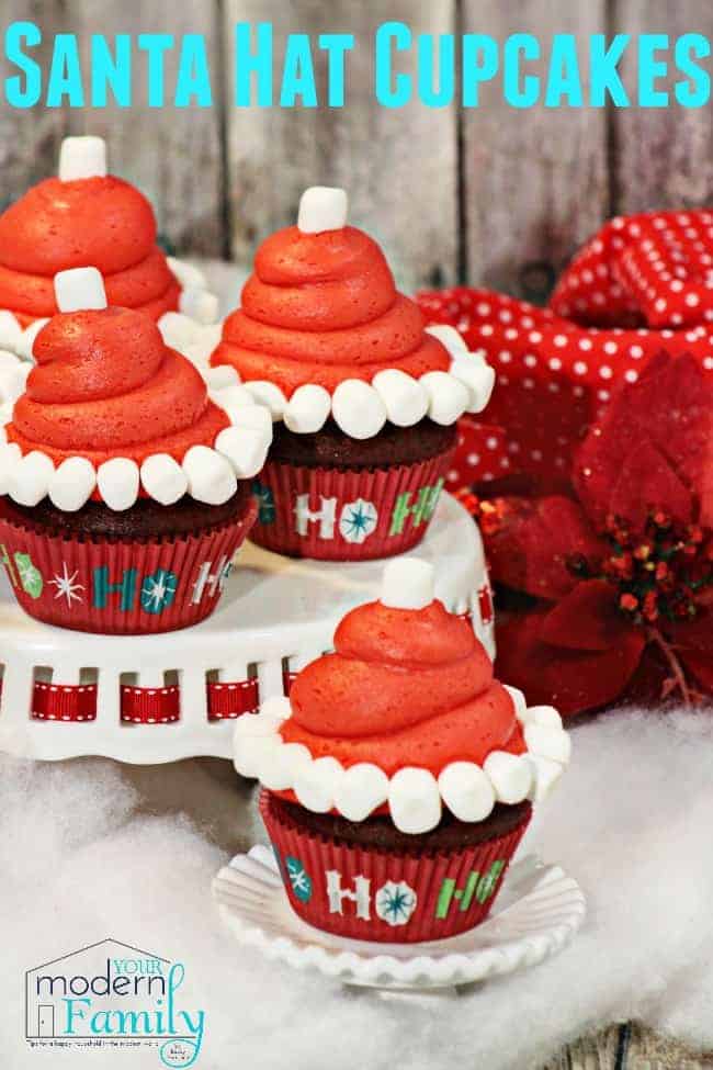 Cupcakes decorated to look like Santa\'s hat.