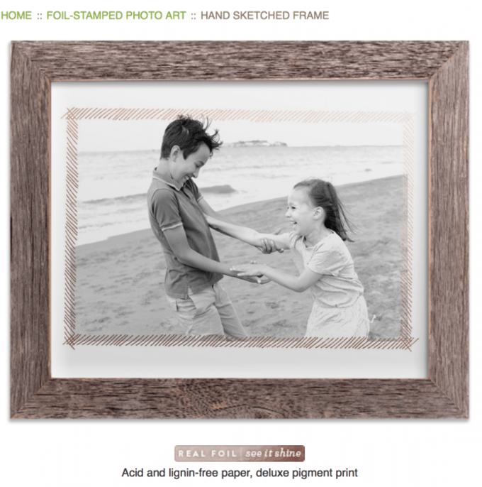 A wooden frame with a picture of two children in it.