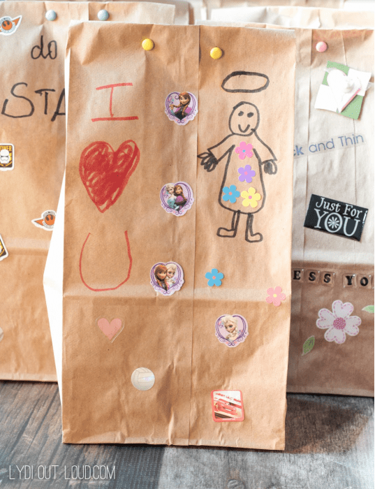 Brown bags decorated with children\'s artwork.