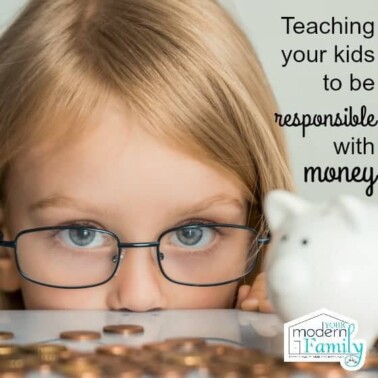 A little girl wearing glasses looking over a table's edge covered with pennies and a piggy bank with text beside her.