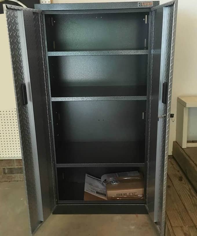 An open metal cabinet with shelving.