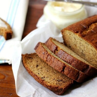 A loaf of banana bread on a plate.