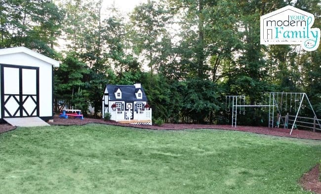 A playhouse in a back yard.