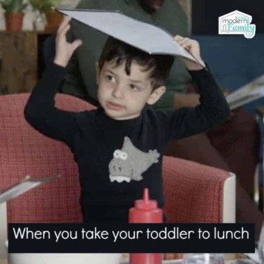 A child with a menu on his head with text below him.