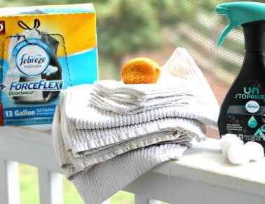 Cleaning products sitting on a porch railing.
