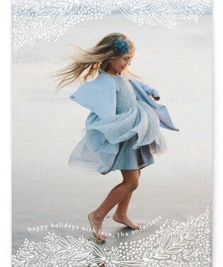 A girl in a blue dress dancing.