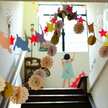 Decorations strung up a set of stairs.