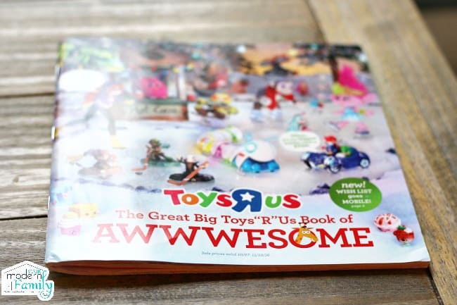 A Toys R Us catalog sitting on a table.