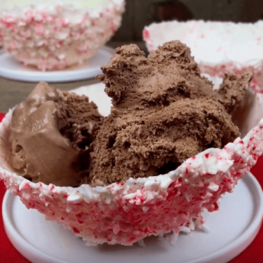 Candy cane bowl with chocolate ice cream in it.