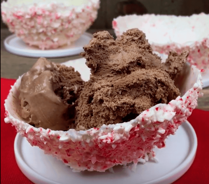 Candy cane bowl with chocolate ice cream in it.