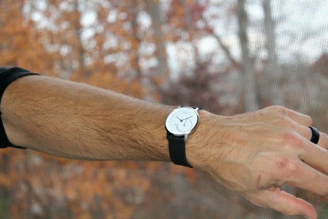A close up of a person wearing a fitness watch.