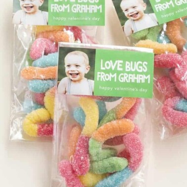 Bags of gummy worms with a picture of a baby and text.