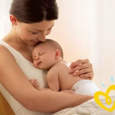 A woman holding a baby.